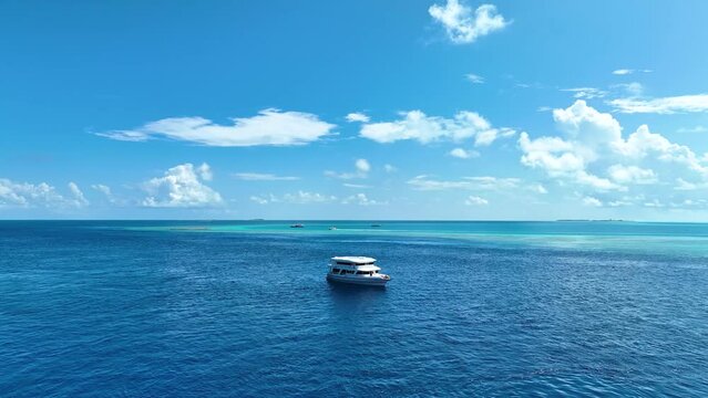 The luxury yacht sailing on the open sea in Maldives