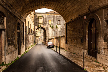 Colorful typical street of the old town of Modica, Sicily, Italy
