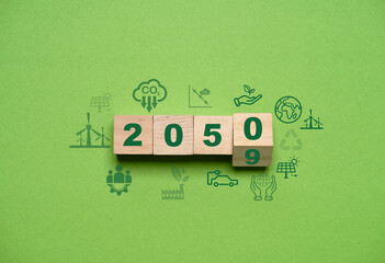 Flipping 2050 and CO2 reducing icon on green background for decrease CO2 emission, carbon footprint...