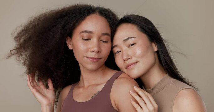 Beauty, hair and portrait of women friends in studio for diversity, inclusion and wellness. Face of model people on beige background for different facial care, makeup glow or cosmetics and wind