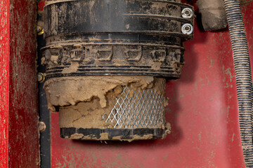 Dirty air filter for cab of combine harvester. Agriculture and farming equipment repair, maintenance and service concept