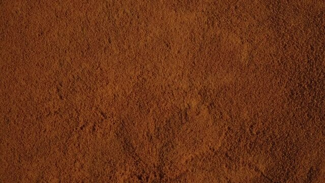 Rose hip fruits are ground in powder. Instant dry drink. Natural antioxidant, contains vitamin C. Texture of Dog rose or briar powder. 4K Video, Rotating.
