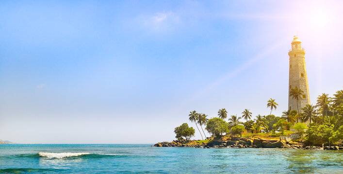 Beautiful beach and lighthouse in Srilanka. Wide photo.