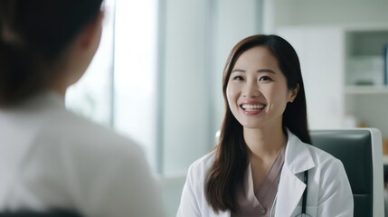 Happy Doctor woman holding on digital tablet and talk and eye contact with patient in clinic