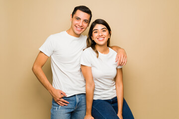 Happy couple in love wearing matching mockup t-shirts