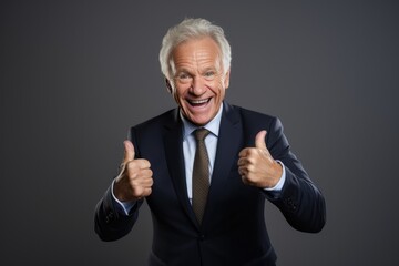 old businessman in smile or happy expression in studio shoot grey background  