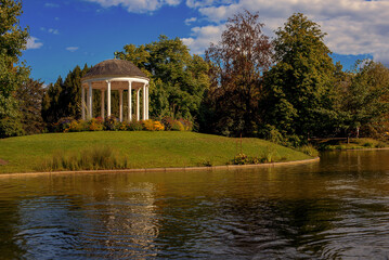 beautiful gazebo on the shore of the pond. landscape by the water