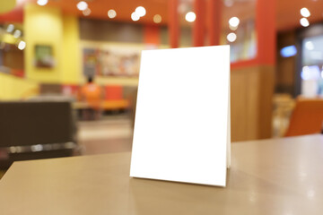 Menu mock up blank for text marketing promotion. Mock up Menu frame standing on wood table in restaurant space for text