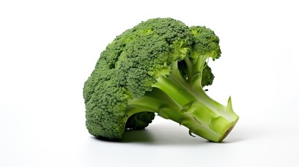 Fresh raw broccoli lying on white background