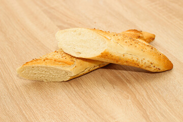 Fresh baguette made of white wheat flour with seeds and cereals