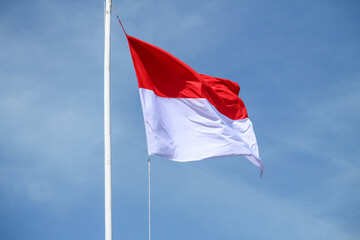 Indonesian flag with blue sky background