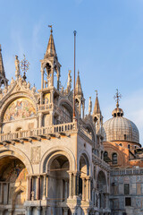 Fototapeta na wymiar Architectural detail with the facade of Saint Marks Basilica in Venice, Italy.,