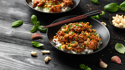 Crispy cashew Chicken stir fry with rice. Asian take away food