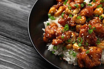 Crispy cashew Chicken stir fry with rice. Asian take away food