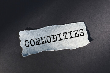 COMMODITIES - word on sheet of torn paper. Business concept, buying, selling, paying for services.