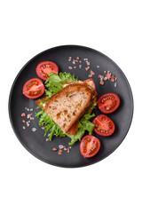 Delicious caprese sandwich with grilled toast, mozzarella, lettuce and tomatoes