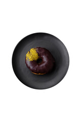 Delicious donut with cream filling and nuts on a dark concrete background