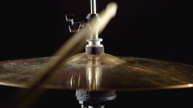 Professional drummer musician man is playing hitting drum kit and cymbals.