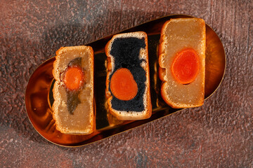 A mooncake  is a Chinese bakery product traditionally eaten during the Mid-Autumn Festival.