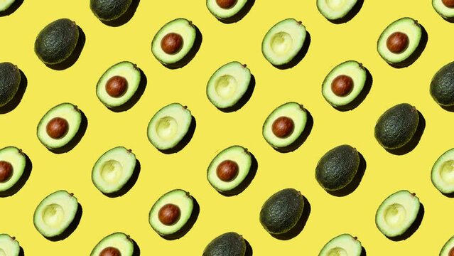 flat lay motion graphics of avocado on yellow background