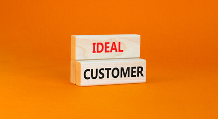 Ideal customer symbol. Concept words Ideal customer on beautiful wooden blocks. Beautiful orange table orange background. Business ideal customer concept. Copy space.
