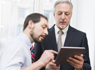 Fototapeta premium Business people using a tablet