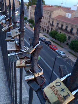 love padlocks attached to a fence