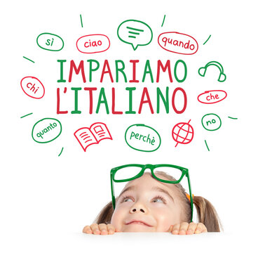 Beautiful cute little girl hiding under a table while looking at the illustrations and "Let's learn Italian" sentence in Italian above her head. Foreign language learning concept.