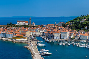 Fototapeta na wymiar A close up aerial view across the harbour and old town of Piran, Slovenia in summertime