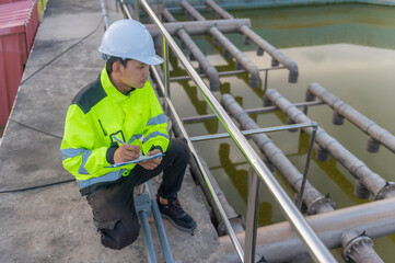 Environmental engineers work at wastewater treatment plants,Water supply engineering working at Water recycling plant for reuse