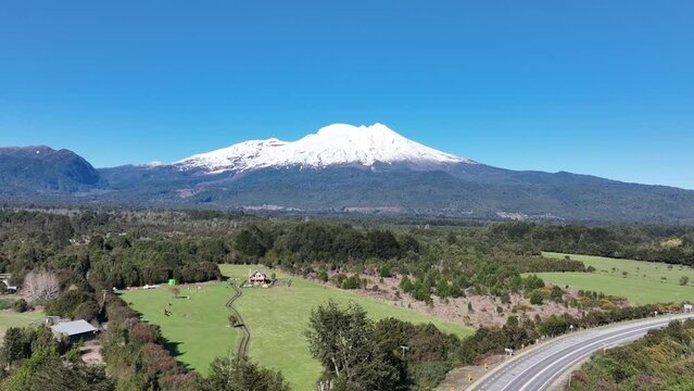 Patagonia Road At Porto Octay In Los Lagos Chile. Volcano Landscape. Sky Clouds Background. Los Lagos Chile. Road Trip Mountain. Patagonia Road At Porto Octay In Los Lagos Chile.