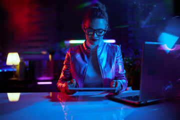 modern business woman in glasses with tablet PC and laptop