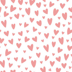 Hand drawn doodle hearts on a background seamless pattern. Valentine`s day theme.Vector illustration.