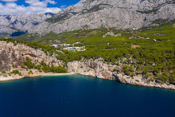 Fototapeta na wymiar Beautiful coastline from a bird's eye view near the city of Makarska, Dalmatia, Croatia. Makarska Riviera, famous and tourist place in Europe