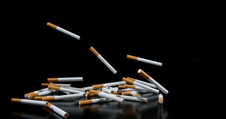 Cigarettes Falling against Black Background