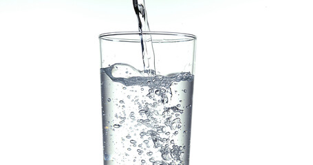 Water being poured into Glass against White Background