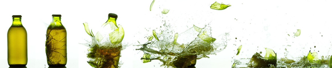 Bottle of Beer Breaking and Splashing against White Background