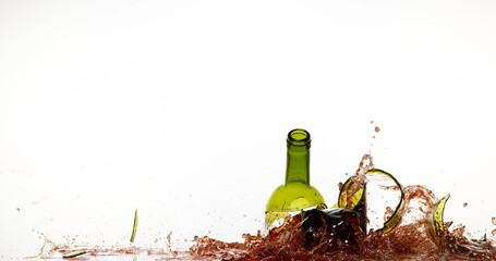 Bottle of Red Wine Breaking and Splashing against White Background