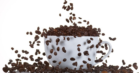 Coffee Beans Falling into a Cup against White Background