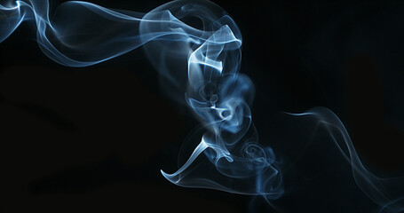 Smoke of Cigarette rising against Black Background