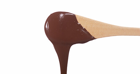 Chocolate Flowing from Wooden Spoon on White Background