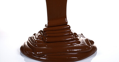 Chocolate Flowing on White Background
