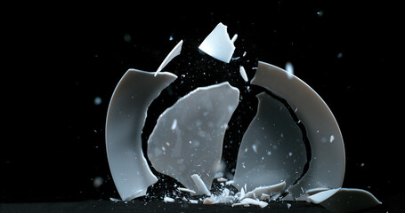 Plate falling and exploding on Black Background