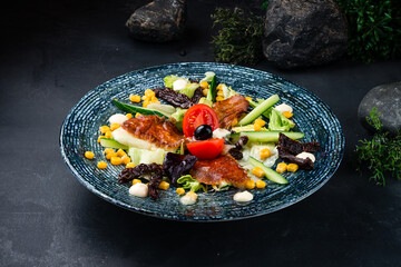 Salad with fried suluguni cheese, sun-dried tomatoes, corn, cucumbers, lettuce and sauce.