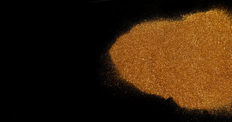 Gold Glitter Falling on Black Background