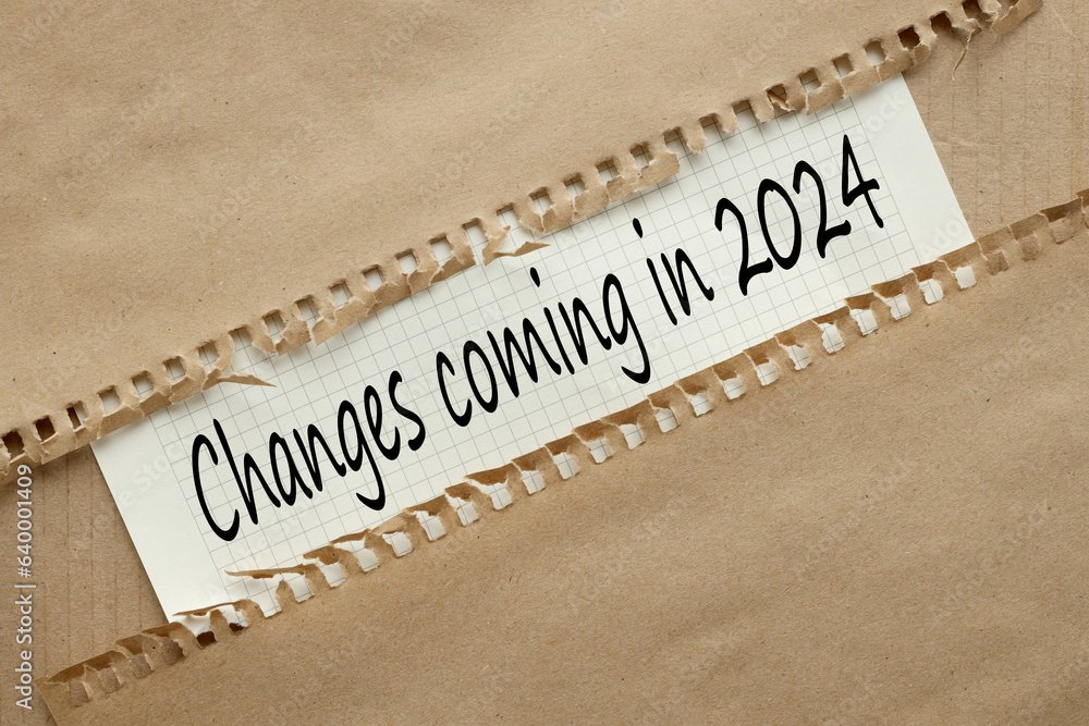 Poster changes coming in 2024 text on white paper. torn craft paper