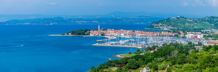 Naklejka premium A panorama view towards the coastal town of Izola, Slovenia in summertime