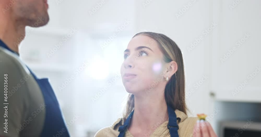 Sticker Romantic, eating and couple cooking together in a kitchen in a conversation bonding in a home or apartment. Happy, man and woman preparing food for lunch or healthy brunch to relax in the weekend