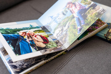 close up. photo book binding. storing photos from a photo session in a photobook (paper with a...