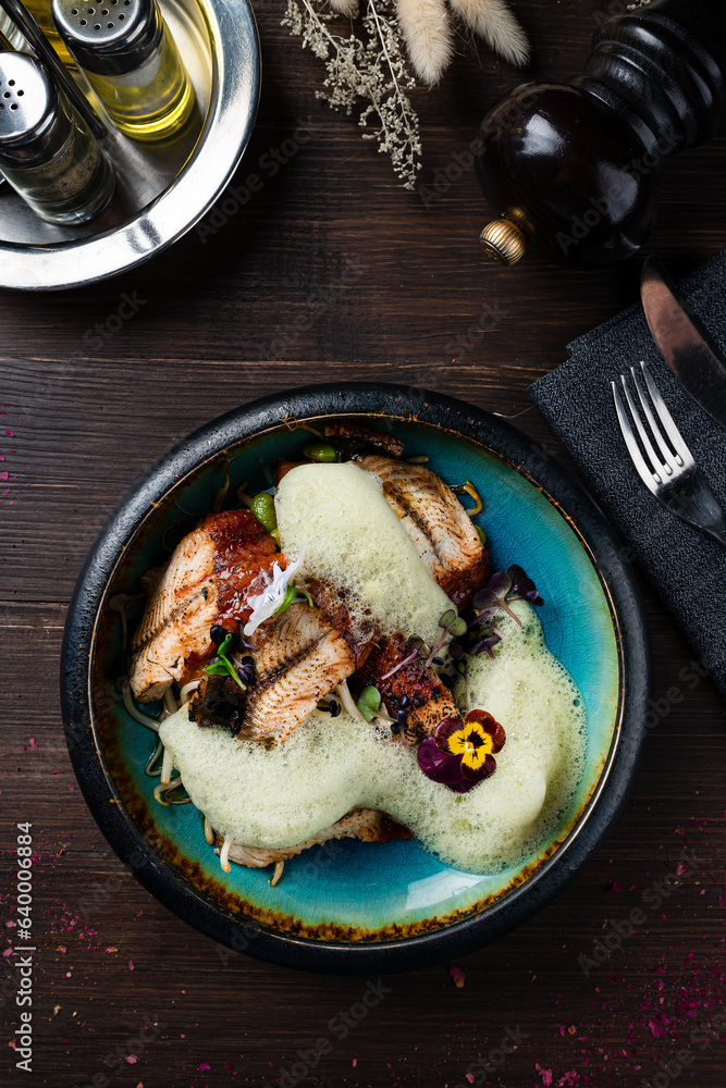 Canvas Prints lunch fried white fish with noodles, sauce and herbs.